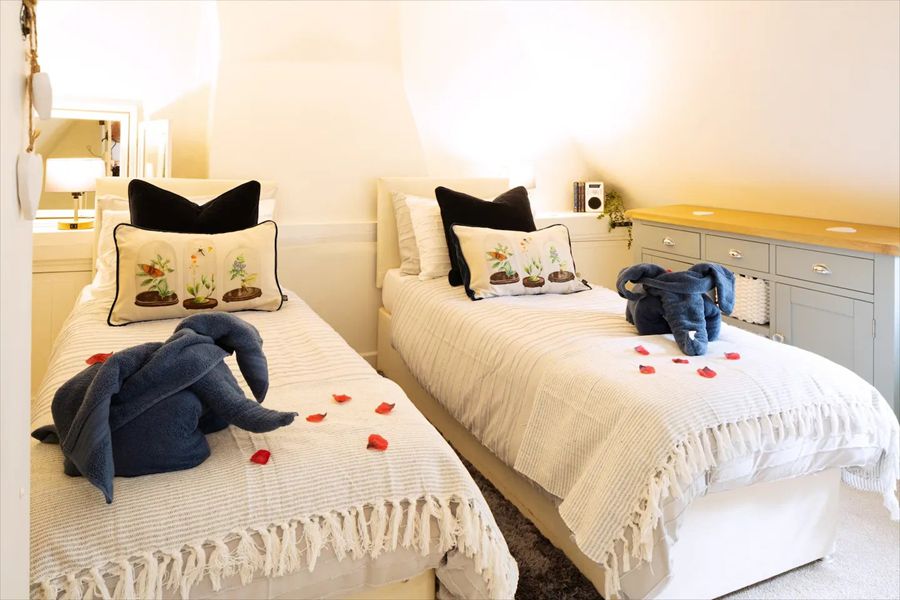 The second bedroom has a king bed which can be converted into two single beds
