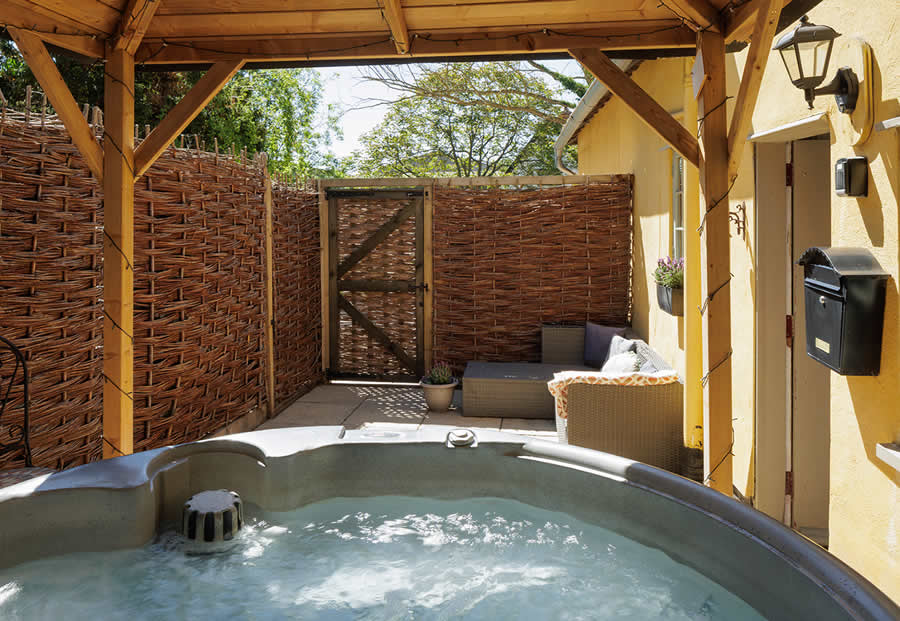 The private enclosed courtyard garden includes the hot tub, gas fired bbq and garden furniture
